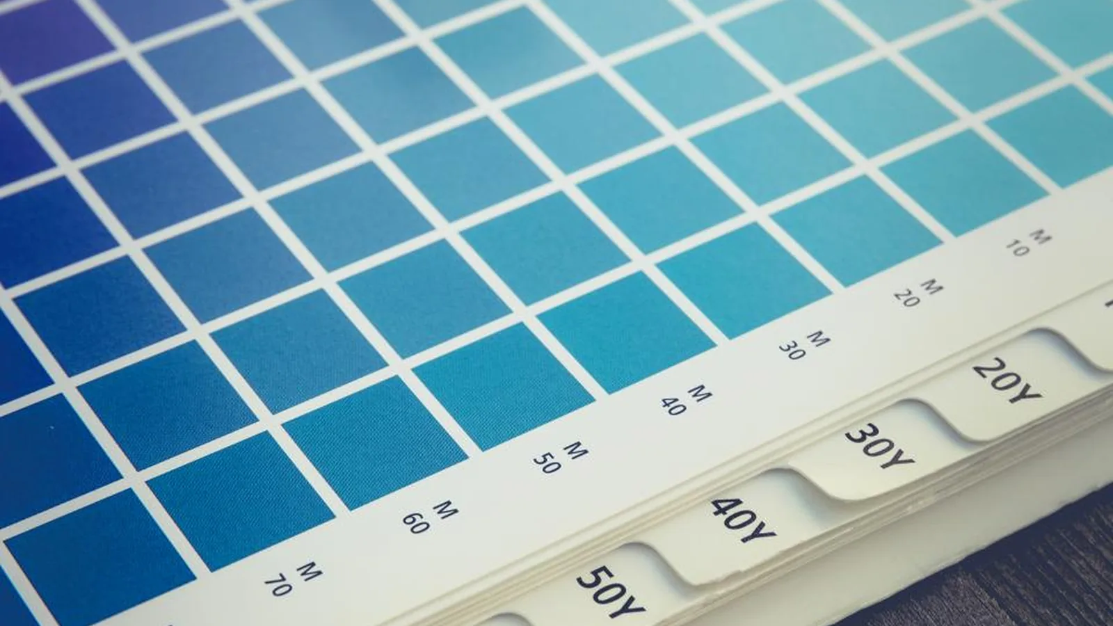A fan of blue printed colour swatches for brand colour matching